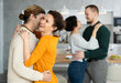 © JackF - Two married couples dance during holiday, have fun, move and jump in dining room. Family event is held with fun music and dancing