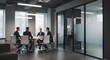 © lepiangg - Out-of-focus shot of a professional team collaborating during a strategic planning session in a modern glass-walled boardroom