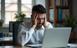 © hao - Headache, stress and tired business man at laptop in office for anxiety, debt crisis and eye strain problem. Burnout, fatigue and worker at computer with pain, brain fog and frustrated with mistake