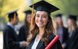 © Lucas - Successful graduation from university. Smiling beautiful girl university or college graduate standing with diploma and looking at camera over mates around and university at background. High quality