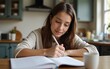© James - Closeup of young female student working on history homework at her kitchen counter. High quality