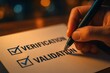 © Viacheslav - Hand holding pen checks boxes beside verification and validation text on paper under warm desk lamp glow