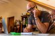 © Martí Rosselló - Florist owner talking on phone managing small business