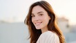 © Matcha_09 - Beautiful young woman with long brown hair smiling warmly outdoors in soft natural light against a peaceful background