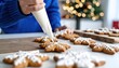 © Magdalena Wojaczek - Joyfully decorating festive snowflake gingerbread cookies with royal icing for a cozy holiday celebration