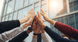 © Firyal Affina - Diverse business team's hands unite in a high-five against a modern office building, symbolizing collaboration, success, and unity.