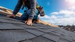 © Pringle - Roofer Installing Asphalt Shingles on Residential Roof — Sunny Day