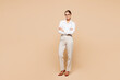 © ViDi Studio - Full body young smiling happy successful employee business woman corporate lawyer wears classic formal white shirt work in office look camera isolated on plain pastel beige background studio portrait.