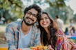 © Markus Schröder - Portrait of a glad indian couple in their 20s having an outdoor picnic
