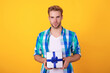 © be free - Party present. Man portrait on February 14. Caucasian guy hold present box for Valentines day. Happy holiday. Man with gift isolated on yellow. Birthday gift. Party on mens day. Mens day