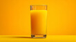 © Tahsin - A glass filled with orange juice stands against a vibrant orange background tone