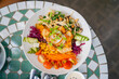 © Ivan - Grilled chicken and squid salad bowl with fresh vegetables