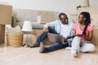 © anatoliycherkas - African couple planning relocation, moving into new house