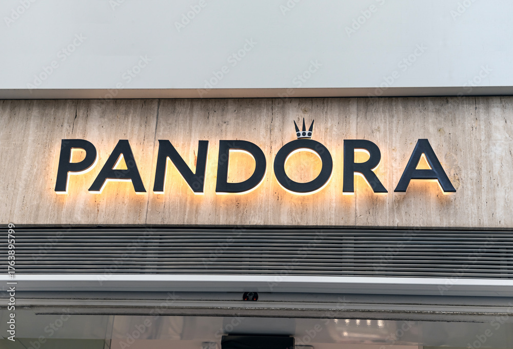 Seville, Spain; October 15, 2025: Pandora jewelry store backlit logo ...