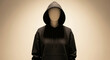 © ADD PHOTO - Black hoodie faceless mannequin hood up minimalistic style dramatic lighting mysterious mood fashion display unisex clothing modern casual studio background