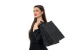 © Atlas - Woman smiles joyfully with black shopping bags, isolated, PNG