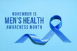 © Atlas - Blue ribbon symbolizes men's health awareness month