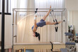 © Phimwilai - Woman exercising on pilates cadillac reformer for flexibility and core strength