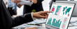 © InfiniteFlow - Business intelligence and data analysis concept. Analyst team working on financial data analysis dashboard on laptop screen as marketing indication for effective business strategic planning. Insight
