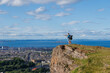 © Sergey Novikov - Exploring hikers point horizon on top of Arthurs Seat, Edinburg