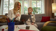 © master1305 - Female psychologist supporting boy during child therapy session in cozy office. Concept of child psychology, emotional support, healthcare communication, and educational materials for therapists.