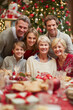 © Maksim Shebeko - Families gather to savor tasty food and share joyful moments during a holiday Generative AI