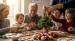 © Evgenii Starkov - Multi-generational family decorating a small Christmas tree with cookies and ornaments together, celebrating holiday traditions at home.