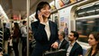 © BrunoStudio - Smiling Asian business woman talking on smartphone in a crowded subway. Successful female professional commuting on public transport. Modern city life and mobile communication.