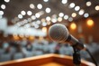 © Vlad - Church Business Meeting. Closeup of Microphone on Dais in Abstract Blurred Auditorium