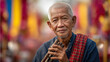 © AI.noevation - Elderly man with traditional flute celebrates Silk & Phuk Seow Festival in Thailand, showcasing cultural heritage and vibrant folk traditions