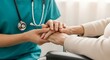 © Sutan8 - Compassionate healthcare worker gently holds elderly patients hands offering comfort and support.