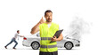© Ljupco Smokovski - Roadside assistance worker making a call gesture and man pushing a car