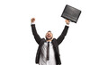 © Ljupco Smokovski - Man celebrating success holding a briefcase and looking up