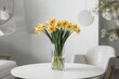 © VirtualVista - Ornate home decor featuring a bouquet of spring blossoms with a plain white backdrop