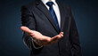 © tisomboon - Businessman in suit extends his hand, inviting collaboration and opportunity