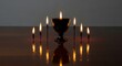 © Ophelia - Kinara candles for kwanzaa celebration with soft reflections and elegant ambiance