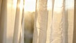 © Komang - Golden morning sunlight streaming through sheer linen window curtains, creating a warm and peaceful glow.
