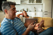 © Marko Geber - Middle aged relaxing at home