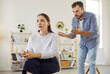 © Studio Romantic - Arguments of couple in deep conflict and tension at home. Sad woman looking away as angry partner scolding with gestures, upset wife with frustration thinking about relationship crisis and divorce