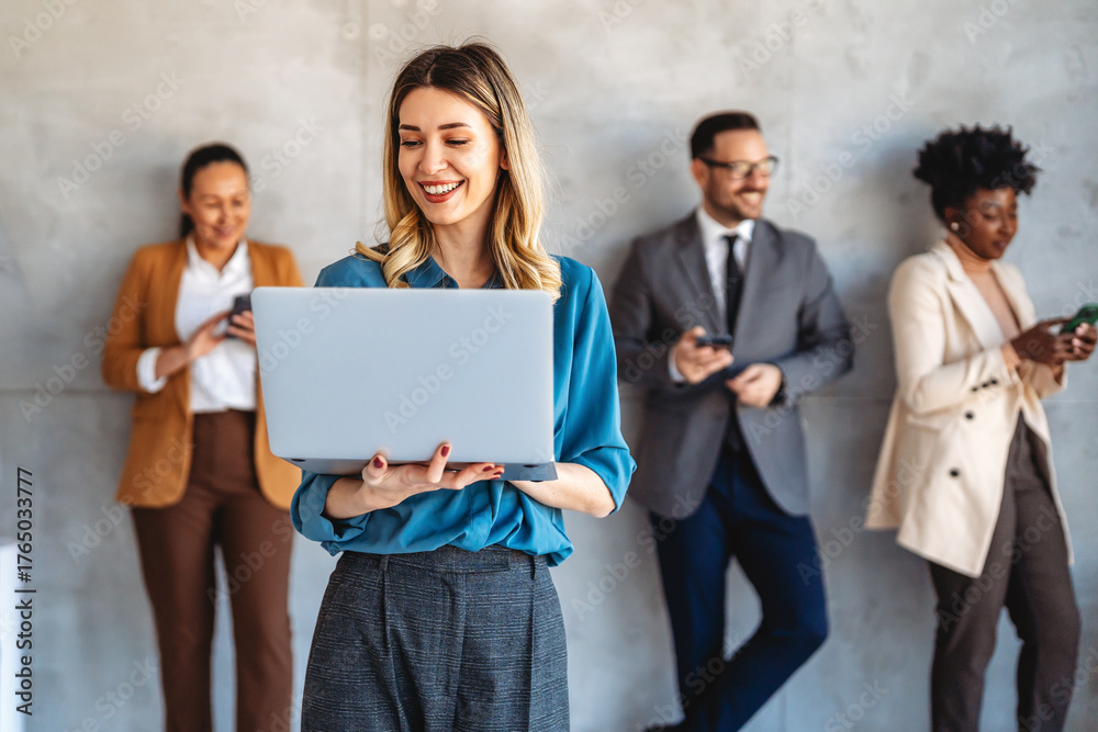 Portrait of successful multicultural business team working in corporate ...