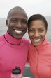 © Konstiantyn Zapylaie - Smiling young african couple enjoying outdoor adventure by the sea