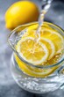© Konstiantyn Zapylaie - Refreshing lemon water in glass jug with fresh slices