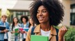 © MdNazim - Young woman with curly hair holding green book smiling