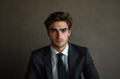 © Varitnan - Confident young businessman sitting in modern office
