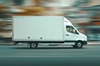 © Maryna - Cube Van Transporting Goods on Road - White Cargo Truck