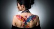 © MHK01 - Stunning woman with vibrant phoenix back tattoo showcasing artistic expression and unique style, perfect for fashion and body art inspiration