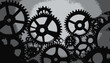 © adzimatul - Artistic depiction of interlocking cogwheels. A monochrome arrangement with a textured background
