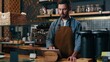 © Yuliia - Serious Caucasian barista bartender male owner typing tablet in cafeteria catering job man manager purchase food online shop restaurant worker waiter guy swiping screen gadget tech cafe small business