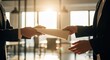 © Chainarong - Professional hands exchanging important business documents in a sunlit modern office, signifying a crucial agreement or partnership