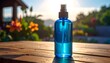 © Dina - Spray bottle with blue liquid on a wooden table outdoors, sunlit garden background